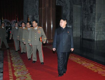 New North Korean leader Kim Jong-un walks with a row of top military officers at the Kumsusan Memorial Palace in Pyongyang New North Korean leader Kim Jong-un walks with a row of top military officers at the Kumsusan Memorial Palace in Pyongyang