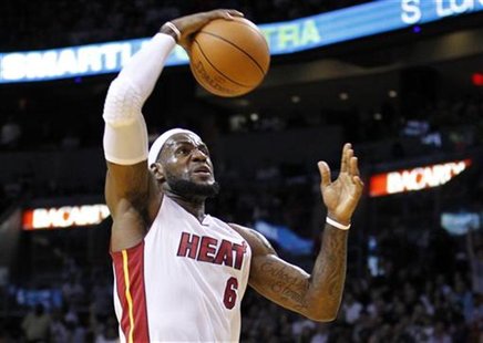 Miami Heat small forward LeBron James drives to the basket in the first quarter of play against the Boston Celtics during their NBA basketba Miami Heat small forward LeBron James drives to the basket in the first quarter of play against the Boston Celtics during their NBA basketba