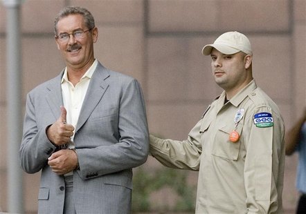 Texas billionaire Allen Stanford flashes a "thumb up" as he leaves the Federal courthouse in Houston, Texas Texas billionaire Allen Stanford flashes a "thumb up" as he leaves the Federal courthouse in Houston, Texas