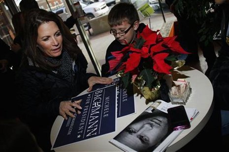 Republican presidential candidate and Representative Bachmann signs an autograph at Uncle Nancy's Coffeeshop in Newton Republican presidential candidate and Representative Bachmann signs an autograph at Uncle Nancy's Coffeeshop in Newton