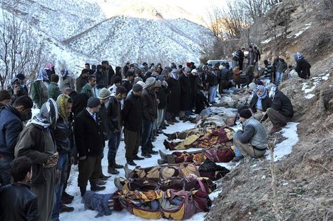 Locals gather around bodies of people who were killed in air strikes in Ortasu village near the southeastern Turkish town of Sirnak Locals gather around bodies of people who were killed in air strikes in Ortasu village near the southeastern Turkish town of Sirnak
