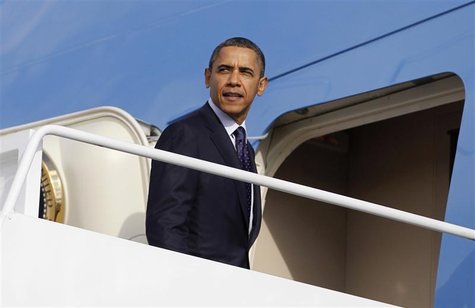U.S. President Obama looks back as he boards the Air Force One at Andrews Air Force Base near Washington U.S. President Obama looks back as he boards the Air Force One at Andrews Air Force Base near Washington