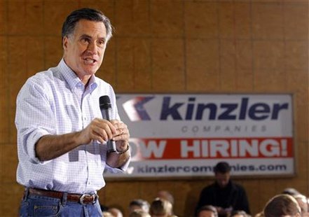 Republican presidential candidate and former Massachusetts Governor Romney speaks in front of a "Now Hiring" sign in Ames Republican presidential candidate and former Massachusetts Governor Romney speaks in front of a "Now Hiring" sign in Ames
