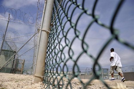 A Guantanamo detainee runs inside an exercise area at the detention facility at Guantanamo Bay U.S. Naval Base A Guantanamo detainee runs inside an exercise area at the detention facility at Guantanamo Bay U.S. Naval Base