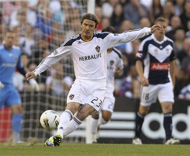 LA Galaxy's David Beckham of England passes the ball during their friendly match against Melbourne Victory LA Galaxy's David Beckham of England passes the ball during their friendly match against Melbourne Victory