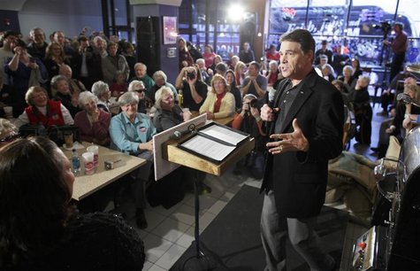 Republican presidential candidate Rick Perry campaigns at the Blue Strawberry Coffee Company in Cedar Rapids Republican presidential candidate Rick Perry campaigns at the Blue Strawberry Coffee Company in Cedar Rapids
