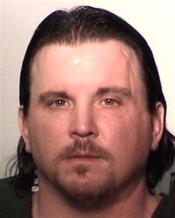 Michael Plumadore is seen in an undated police booking photo Michael Plumadore is seen in an undated police booking photo