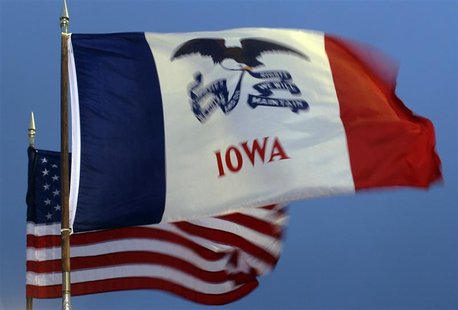 The U.S. and Iowa state flags fly at a rally with Republican presidential candidate and former Massachusetts Governor Romney in West Des Moi The U.S. and Iowa state flags fly at a rally with Republican presidential candidate and former Massachusetts Governor Romney in West Des Moi