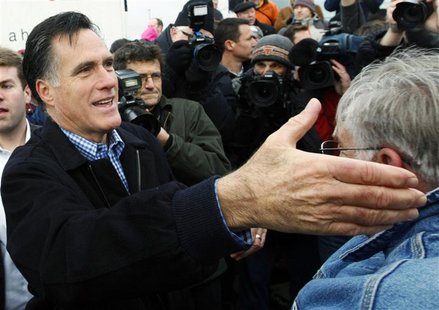 Republican presidential candidate and former Massachusetts Governor Mitt Romney reaches to shake hands with a supporter after a campaign ral Republican presidential candidate and former Massachusetts Governor Mitt Romney reaches to shake hands with a supporter after a campaign ral