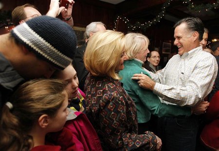 Republican presidential candidate and former Massachusetts Governor Romney hugs a supporter during his campaign stop at Old Salt Restaurant Republican presidential candidate and former Massachusetts Governor Romney hugs a supporter during his campaign stop at Old Salt Restaurant