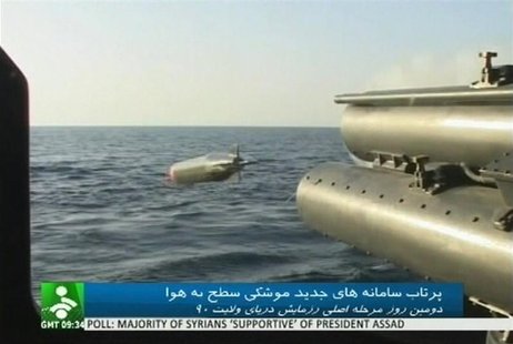 Still image of an Iranian warship launching a missile in an unknown location