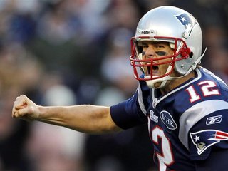 New England Patriots quarterback Brady reacts after completing a touchdown pass against the Buffalo Bills during the fourth quarter of their