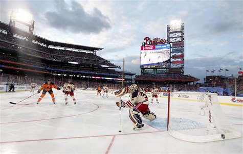 New York Rangers goalie Henrik Lundqvist plays the puck against the Philadelphia Flyers during the second period in the NHL Winter Classic h New York Rangers goalie Henrik Lundqvist plays the puck against the Philadelphia Flyers during the second period in the NHL Winter Classic h