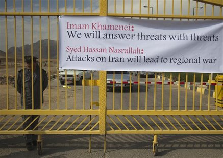 Security officer stands next to banner at the entrance of the Uranium Conversion Facility in Isfahan Security officer stands next to banner at the entrance of the Uranium Conversion Facility in Isfahan