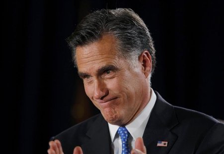 Republican presidential candidate and former Massachusetts Governor Mitt Romney addresses supporters at his Iowa Caucus night rally in Des M Republican presidential candidate and former Massachusetts Governor Mitt Romney addresses supporters at his Iowa Caucus night rally in Des M