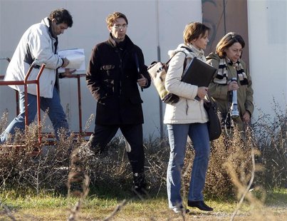 French judge Annaick Le Goff leaves with Dominique Lucciardi , former companion of Jean-Claude Mas, after a search at an abandoned building French judge Annaick Le Goff leaves with Dominique Lucciardi , former companion of Jean-Claude Mas, after a search at an abandoned building