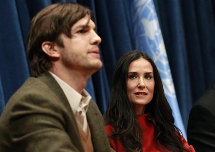 Actor Kutcher speaks as his wife actress Moore looks on during a conference at the United Nations Headquarters in New York Actor Kutcher speaks as his wife actress Moore looks on during a conference at the United Nations Headquarters in New York
