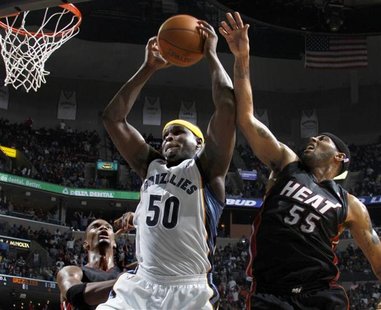 Memphis Grizzlies center Randolph shoots defended by Miami Heat forwards Bosh and James during the second half of NBA basketball action in M Memphis Grizzlies center Randolph shoots defended by Miami Heat forwards Bosh and James during the second half of NBA basketball action in M