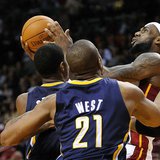 Miami Heat's LeBron James is defended by Indiana Pacers's George and West during their NBA basketball game in Miami. Miami Heat's LeBron James is defended by Indiana Pacers's George and West during their NBA basketball game in Miami.