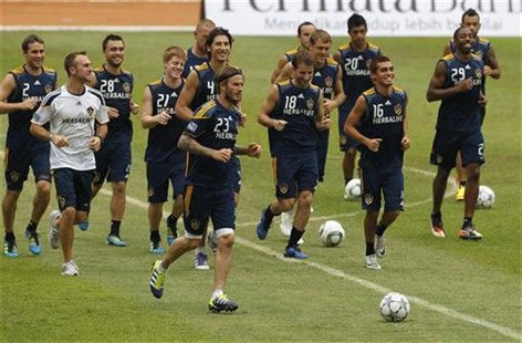 David Beckham and his teammates from Los Angeles Galaxy run during a training season at Bung Karno stadium in Jakarta David Beckham and his teammates from Los Angeles Galaxy run during a training season at Bung Karno stadium in Jakarta