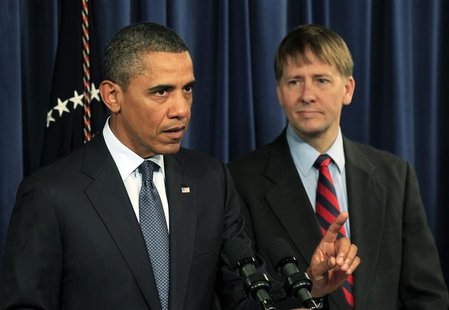 President Barack Obama speaks as Richard Cordray, his appointed head of the Consumer Financial Protection Bureau, stands at his side during President Barack Obama speaks as Richard Cordray, his appointed head of the Consumer Financial Protection Bureau, stands at his side during
