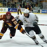 Western Michigan's Chase Balisy challenges Minneota-Duluth's Jake Hendrickson at Lawson Arena, Jan 6, 2012.  The Bulldogs prevailed 4-1.  Photo by Sean Patrick Duross.