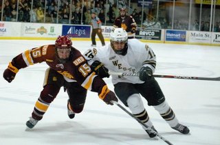 Western Michigan's Chase Balisy challenges Minneota-Duluth's Jake Hendrickson at Lawson Arena, Jan 6, 2012.  The Bulldogs prevailed 4-1.  Photo by Sean Patrick Duross.