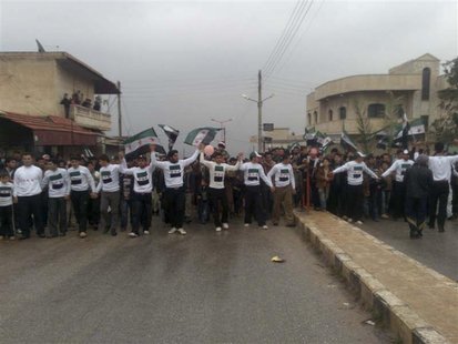 Demonstrators protest against Syria's President Bashar al-Assad after their Friday prayers in Kafranbel Demonstrators protest against Syria's President Bashar al-Assad after their Friday prayers in Kafranbel