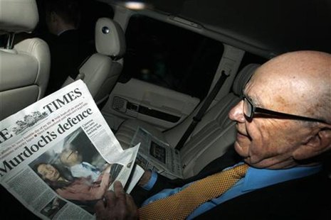 News Corp Chief Executive and Chairman Rupert Murdoch holds a copy of The Times newspaper as he leaves his home in London News Corp Chief Executive and Chairman Rupert Murdoch holds a copy of The Times newspaper as he leaves his home in London