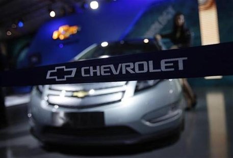 A model stands besides a GM Chevrolet Volt car during India's Auto Expo in New Delhi A model stands besides a GM Chevrolet Volt car during India's Auto Expo in New Delhi