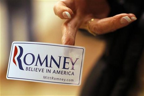 A woman hands out campaign stickers before a rally of Republican presidential candidate Romney in Exeter A woman hands out campaign stickers before a rally of Republican presidential candidate Romney in Exeter