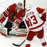 Chicago Blackhawks' goalie Crawford makes a save off Detroit Red Wings' Datsyuk during their NHL hockey game in Chicago Chicago Blackhawks' goalie Crawford makes a save off Detroit Red Wings' Datsyuk during their NHL hockey game in Chicago