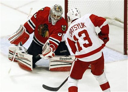 Chicago Blackhawks' goalie Crawford makes a save off Detroit Red Wings' Datsyuk during their NHL hockey game in Chicago Chicago Blackhawks' goalie Crawford makes a save off Detroit Red Wings' Datsyuk during their NHL hockey game in Chicago
