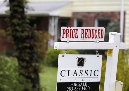 A "Price Reduced" sign is displayed on a home for sale in northern Virginia suburb of Vienna A "Price Reduced" sign is displayed on a home for sale in northern Virginia suburb of Vienna