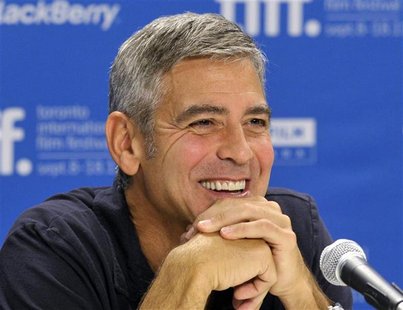 Actor George Clooney smiles during the news conference for the film "The Descendants" at the 36th Toronto International Film Festival Actor George Clooney smiles during the news conference for the film "The Descendants" at the 36th Toronto International Film Festival