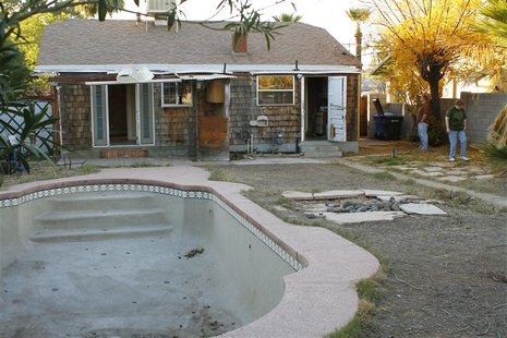 Paul Hennings and his wife Sheila Krueger stand in the backyard of their newly purchased home in Phoenix, Arizona December 11, 2010. Paul Hennings and his wife Sheila Krueger stand in the backyard of their newly purchased home in Phoenix, Arizona December 11, 2010.