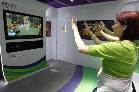 Liz Miller of Los Angeles plays Kinect for Star Wars at the Microsoft XBOX 360 booth at E3 in Los Angeles Liz Miller of Los Angeles plays Kinect for Star Wars at the Microsoft XBOX 360 booth at E3 in Los Angeles