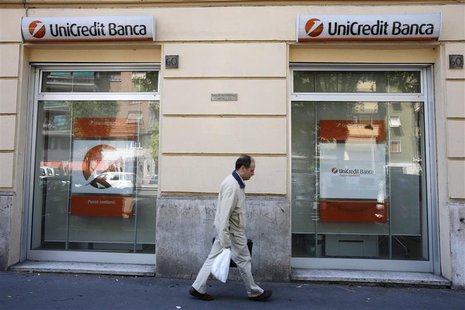 A man walks past the entrance to a Unicredit bank office in Rome A man walks past the entrance to a Unicredit bank office in Rome