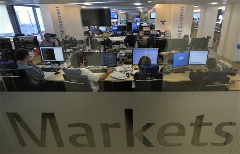 Experts work at their screens in the NYSE Euronext cash markets operations room in Paris Experts work at their screens in the NYSE Euronext cash markets operations room in Paris