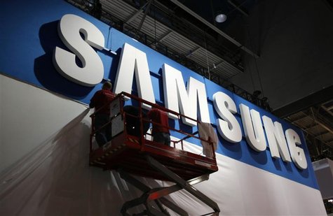 Workers prepare the booth for Samsung at the Consumer Electronics Show opening in Las Vegas. Workers prepare the booth for Samsung at the Consumer Electronics Show opening in Las Vegas.