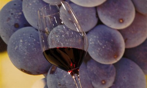 A glass of red wine is displayed at Vinitaly wine expo in Verona A glass of red wine is displayed at Vinitaly wine expo in Verona