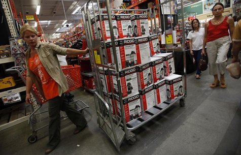 A worker hauls a load of sump pumps onto the shopping floor at a Home Depot store in Freeport on Long Island A worker hauls a load of sump pumps onto the shopping floor at a Home Depot store in Freeport on Long Island