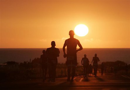 Runners leave the "Energy Lab", which is the halfway point of the marathon length run portion of the Ironman World Championship triathlon in Runners leave the "Energy Lab", which is the halfway point of the marathon length run portion of the Ironman World Championship triathlon in