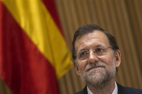 Spanish Prime Minister Mariano Rajoy gestures during a meeting with the People's Party parliament members in Madrid Spanish Prime Minister Mariano Rajoy gestures during a meeting with the People's Party parliament members in Madrid