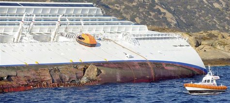 Holes are seen on a cruise ship that ran aground off the west coast of Italy at Giglio island