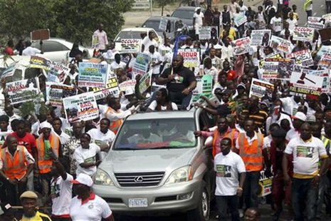 Members of the Niger Delta People Volunteers Force march in support of Nigeria's President Goodluck Jonathan on fuel subsidies removal in th