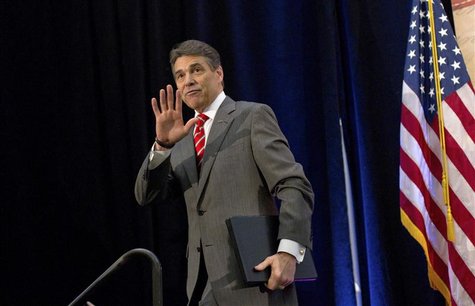 Republican presidential candidate Texas Governor Rick Perry waves after speaking during the Faith and Freedom Prayer Breakfast in Myrtle Bea Republican presidential candidate Texas Governor Rick Perry waves after speaking during the Faith and Freedom Prayer Breakfast in Myrtle Bea