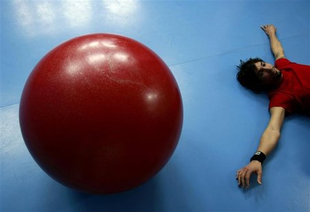 Instructor Ramirez relaxes in a circus studio in Athens Instructor Ramirez relaxes in a circus studio in Athens
