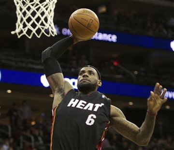 Miami Heat's James stuffs the ball against the New Jersey Nets in their NBA basketball game in Newark Miami Heat's James stuffs the ball against the New Jersey Nets in their NBA basketball game in Newark