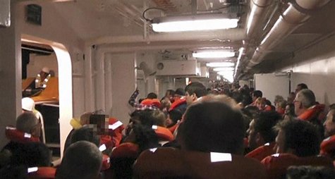 Passengers put on life vests along the corridors of Costa Concordia cruise ship near Giglio Passengers put on life vests along the corridors of Costa Concordia cruise ship near Giglio
